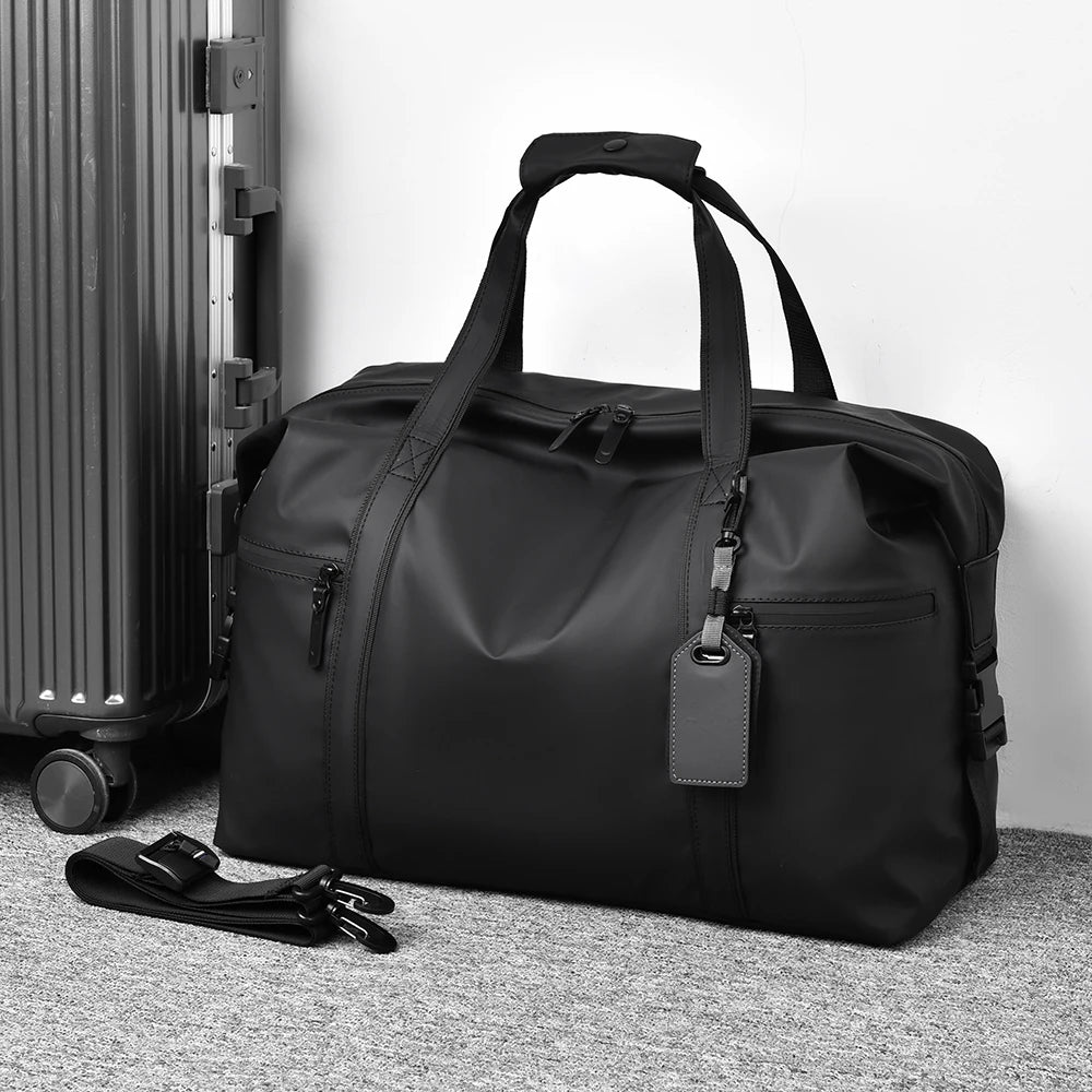 Sac de voyage noir à bandoulière – Formats S et L